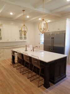 A beautiful dining area with white color cabinets