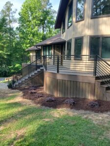 A home with a deck and stairs.